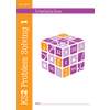 The front cover of a KS2 maths workbook for ages 7 to 11, featuring a colourful cube with numbers and symbols